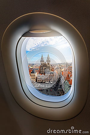 View from an airplane window to the old town and famous Tyn Church of the European city Stock Photo