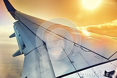 View of airplane wing through the window Stock Photo