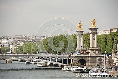 View of the Alexander lll Bridge . By the embankments are movin Editorial Stock Photo