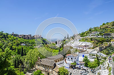 View of Alhambra with Gypsy Cave Sacromonte in Granada, Andalucia, Spain Stock Photo