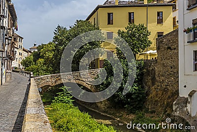 A view along the Darro river in the Albaicin district of Granada Stock Photo