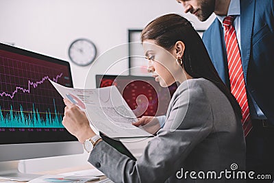 View of analysts working with graphs while testing security of computer systems Stock Photo