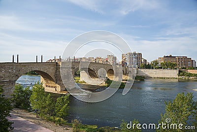 Stone Bridge and Ebro River in Zaragoza, Spain Stock Photo