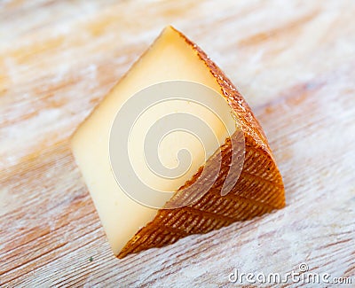 View of a piece of semi-hard cheese Stock Photo