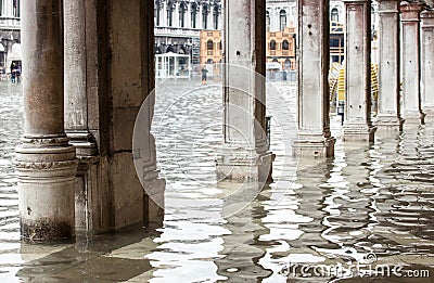 View of the arcades with high water in Venice. Stock Photo