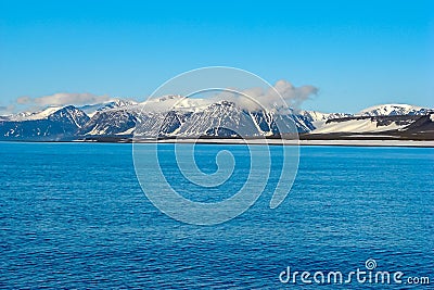 A view of the Arctic island from the sea,beyond the ocean. Stock Photo