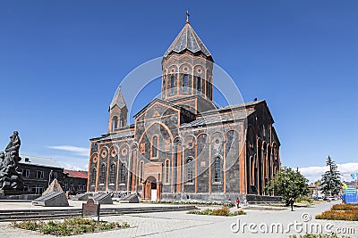 View of the Armenian Apostolic Church of the Holy Saviour and the monument to those killed in the devastating earthquake of 1988. Editorial Stock Photo