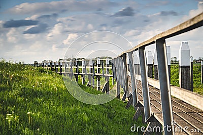 View on the authentic old harbor with wooden seawall and wooden Jetty, Schokland, Netehrands Stock Photo