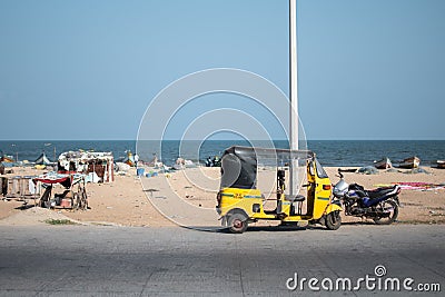 View of a auto rickshaw and a motorbike by Chennai Beach, Tamil Nadu, India Editorial Stock Photo