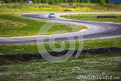 View of autodrome race circuit racetrack with a line of cars driving and racing, with audience and during rally autocross racing Stock Photo