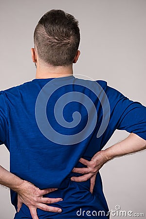 Man having back loins pain ache Stock Photo