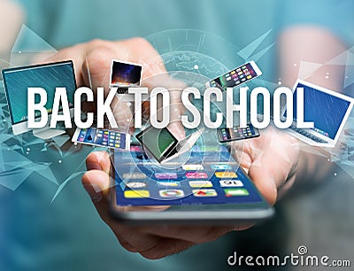 Back to school title surounded by device like smartphone, tablet Stock Photo