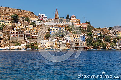 View of the Bay and the colorful houses of Symi island, Greece Stock Photo