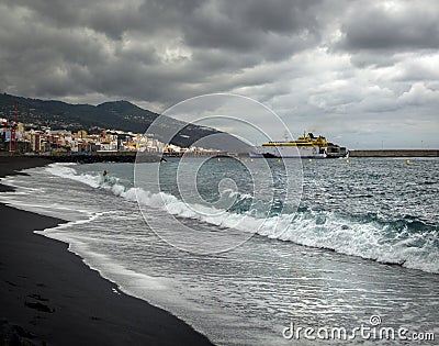 View from the beach Bahamar. Bad weather on La Palma. Ferries between the islands. Black sand of the Canary Islands. Editorial Stock Photo