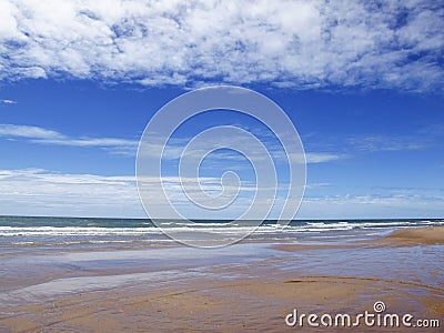 Beach and water surface of sea or ocean with horizon and blue sk Stock Photo