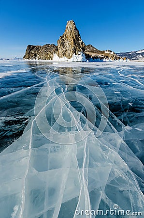 View of beautiful drawings on ice from cracks and bubbles of deep gas on surface of Baikal lake in winter, Russia Stock Photo