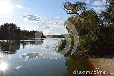 View of a beautiful forest lake designed for fishing, in the midst of lush greenery, in the territory of a natural national park Stock Photo