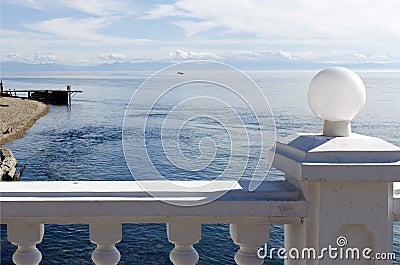 The view from behind the white fence on the source of the Angara River flowing from Lake Baikal Stock Photo