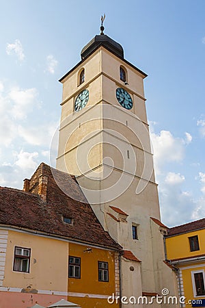 View of the bell tower of the Roman Catholic Church of the Holy Trinity in the city of Sibiu. Transylvania. Romania Stock Photo