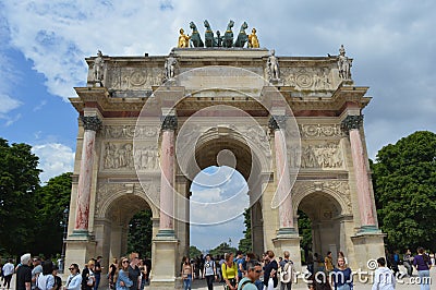 View from below to Arc de Triomphe du Carrousel and people walking Editorial Stock Photo