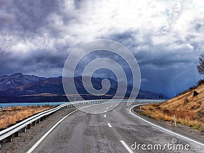 A view on the Ben Ohau range from state highway on the South Island of New Zealand on a rainy cloudy day Stock Photo