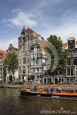 View of a big cruise canal tour boat, trees Editorial Stock Photo