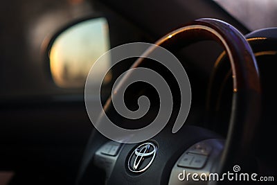 View of the black interior of toyota camry with dashboard, media system, steering and shift gear. Close up of the Editorial Stock Photo