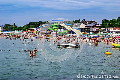 View from the Black Sea to the beach in Zalizny Port. A lot of people swim in the water Editorial Stock Photo