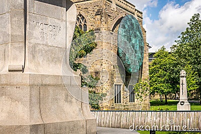 A view of Blackburn cathedral with statue of Queen Victoria Stock Photo