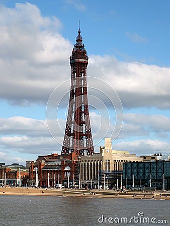 Blackpool with the north pier buildings and tower reflected in the sea with a blue cloudy sky Editorial Stock Photo