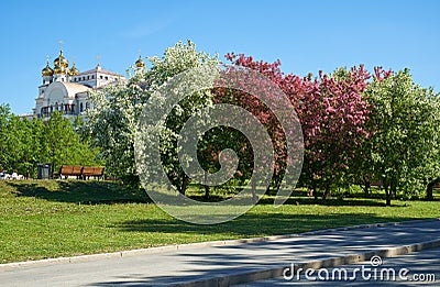 View of blossoming spring park in Yekaterinburg and the Temple of St Nicholas in the background Editorial Stock Photo