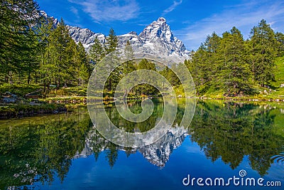 View of the Blue lake Lago Blu near Breuil-Cervinia and Cervino Mount Matterhorn in Val D`Aosta,Italy. Stock Photo