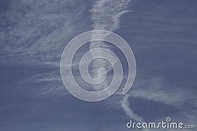 View of blue sky with interesting shapes of clouds and lines Stock Photo