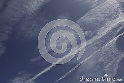 View of blue sky with interesting shapes of clouds and lines Stock Photo