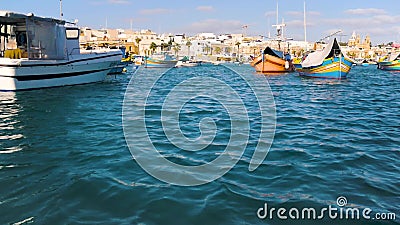 View from the boat tourists to the coastal city, yachts, sea, boats. The ordinary life of Valletta, Malta. Sunny day. View from the boat tourists to the coastal stock footage View from the boat tourists to the coastal city, yachts, sea, boats. The ordinary life of Valletta, Malta. Sunny day. View from the boat tourists to the coastal stock footage