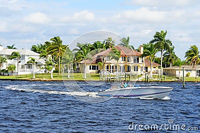 Boat and waterfront home by the bay near Cape Coral, Florida, U.S.A Stock Photo