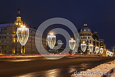 View of Bolshoy Moskvoretsky bridge with lanterns in the form of glasses of champagne in the evening, Moscow Stock Photo
