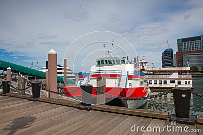 View of Boston from harbor and rowes wharf at sunset Editorial Stock Photo