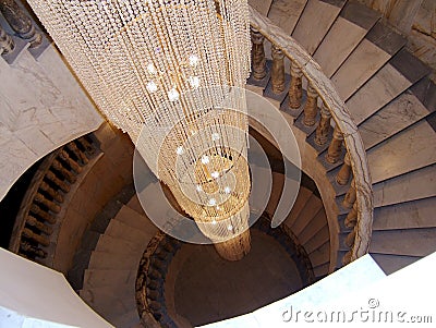 View bottom up on beautiful luxury staircase with wooden railings Stock Photo