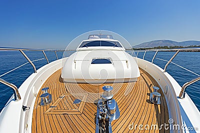 Bow of a luxury motor yacht cruising the blue sea. Stock Photo
