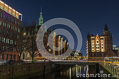 View of the bridge and the brick building in Hamburg, night illumination Editorial Stock Photo
