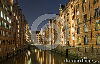 View of the bridge and the brick building in Hamburg, night illumination Stock Photo