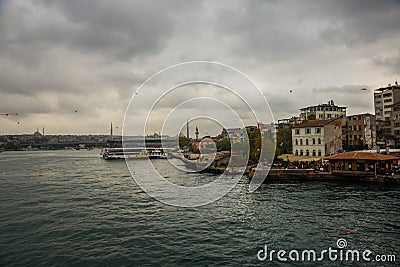 A view of the bridge of the mosque in cloudy weather..Sea front landscape of Istanbul. Tourist Istanbul city landscape. Istanbul Editorial Stock Photo