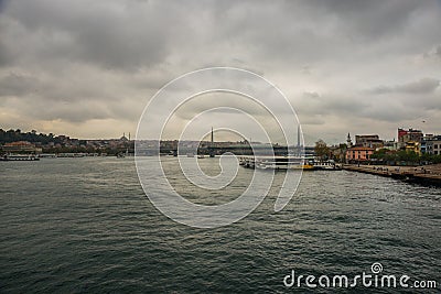 A view of the bridge of the mosque in cloudy weather..Sea front landscape of Istanbul. Tourist Istanbul city landscape. Istanbul Editorial Stock Photo