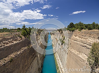View from the bridge to the boats and yachts passing through the Corinth Canal from a sunny day on Peloponnese in Greece Stock Photo