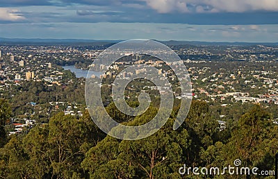 View of Brisbane Queensland Australia from lookout on top of Mt Coot-tha with trees in the foreground and a Kookaburra bird Stock Photo