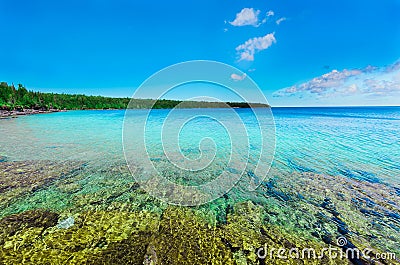 View of Bruce Peninsula park at Georgian bay, Lake Huron with crystal clear turquoise, tranquil fresh water, sunny summer enjoyab Stock Photo