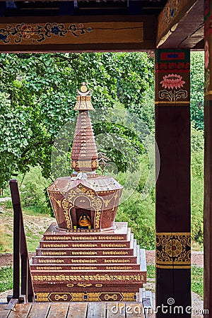 View of the Buddhist Stupa from the arbor for meditations Stock Photo