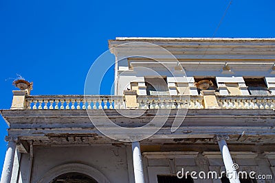 Building in disrepair with typical Caribbean architecture Stock Photo