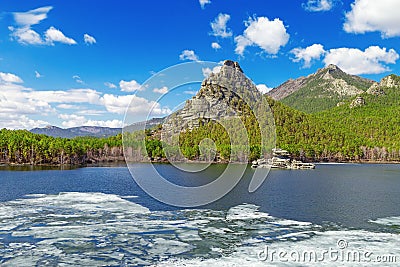 View of Burabai Lake with ice and mysterious rock Zumbaktas. Lake is located in Burabay National Nature Park Stock Photo
